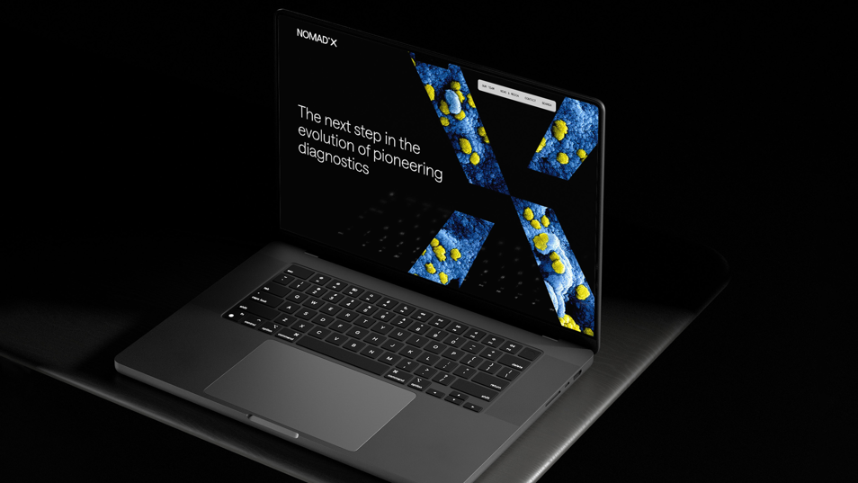NomadX website homepage on laptop